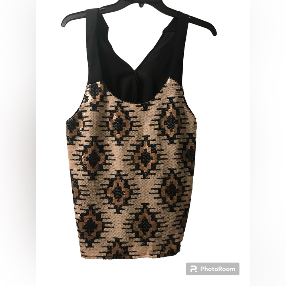 Size Large boutique sequence top with button in back for tapered look